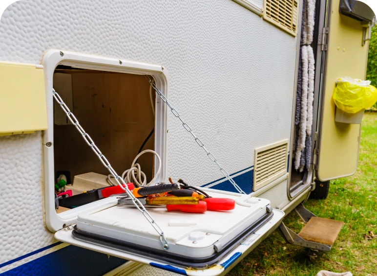 RV storage hatch open with gear